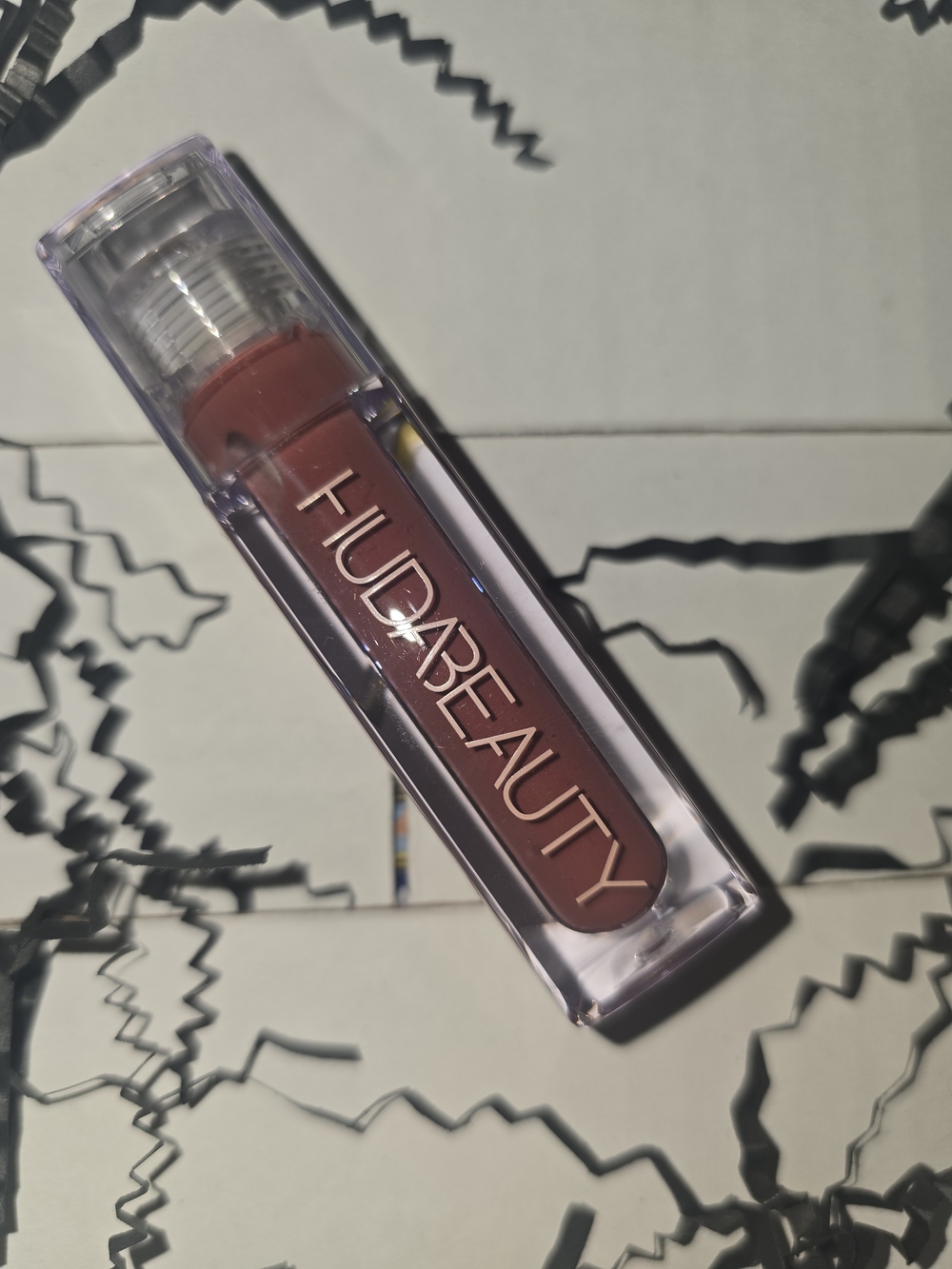 HUDA BEAUTY Fauxfiller Gloss in Bombshell